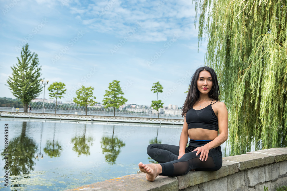 Young slim woman in sportswear sit and relaxing resting after morning sport training Young slim woman in sportswear sit and relaxing resting after morning sport training