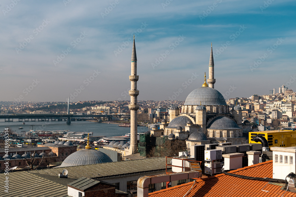 Fototapeta premium Eminonu Halic Port, New Mosque - Valide Sultan Mosque and Golden Horn Metro Bridge in Istanbul Turkey