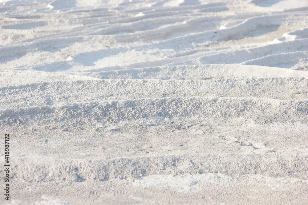 Calcium travertine terraces in Pamukkale, Turkey. Limestone travertine surface.