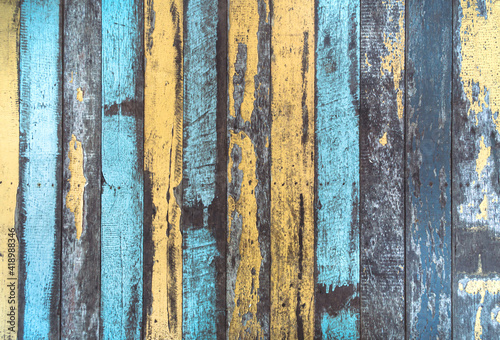 The vintage color wood background. The texture of the retro wood grain table. Decorated and colorful old wood wall. Blue painted vintage weathered wooden planks closeup. Abstract wooden background.