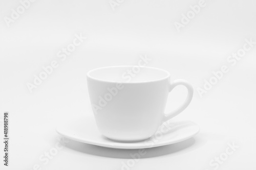 Empty white coffee cup with saucer Isolated on white background with copy space for text