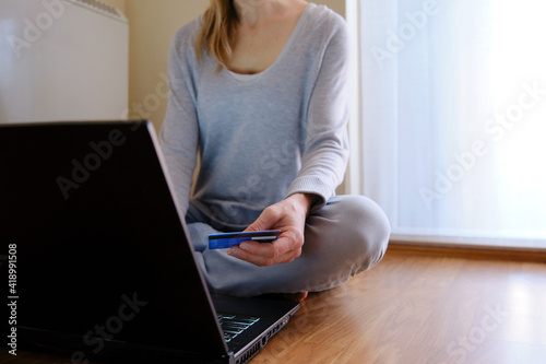 Concept of doing shopping without leaving your house. Woman shopping on-line