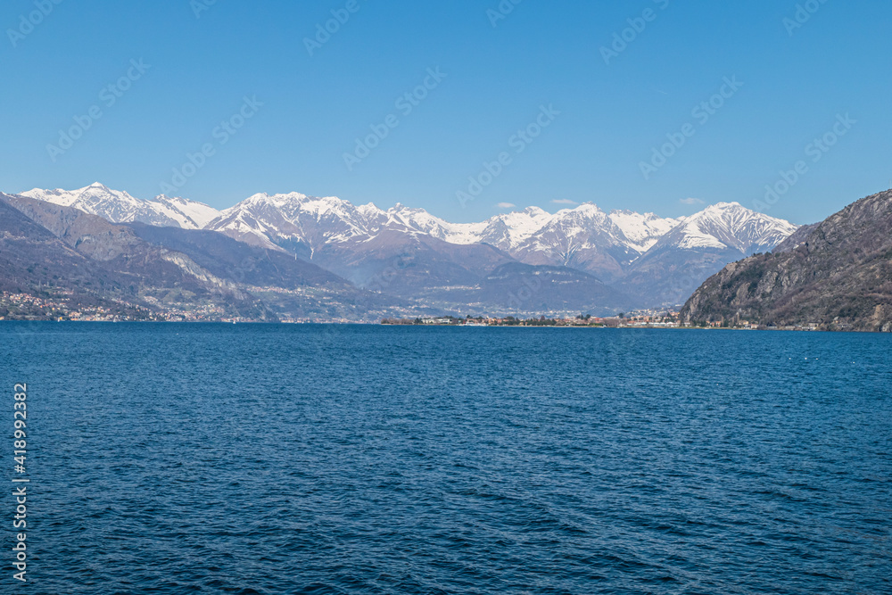 Landscape of the Lake of Coo with Dervio and the Alps in background