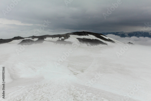 Snowy and foggy white landscape at Fimmvorduhals hiking trail, Iceland photo