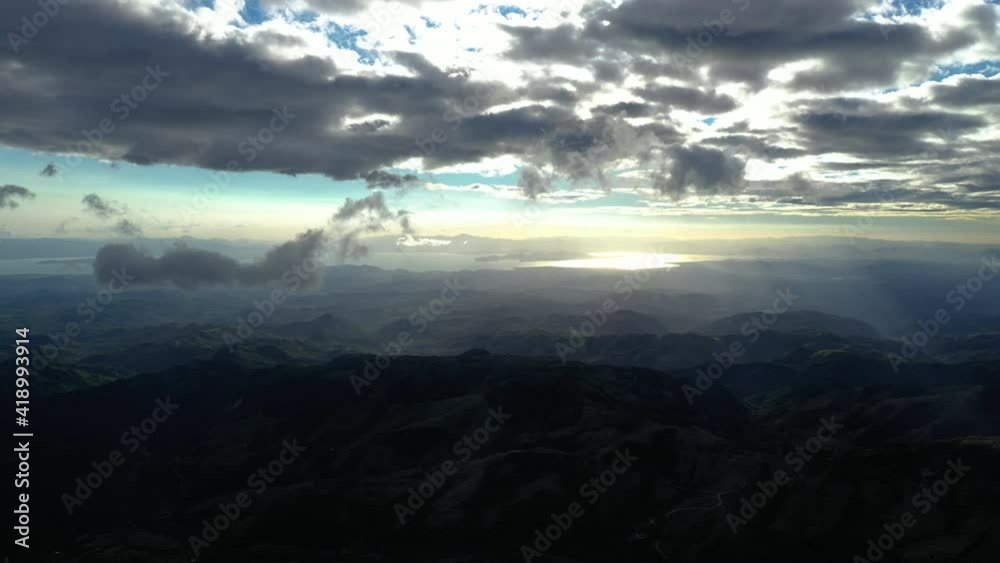 High altitude aerial view over Monteverde mountains northern Costa Rica cloudy windy sunset High altitude aerial view over Monteverde mountains northern Costa Rica cloudy windy sunset
