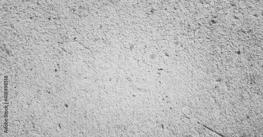 Grungy wall background with cracks, stones and paint. 