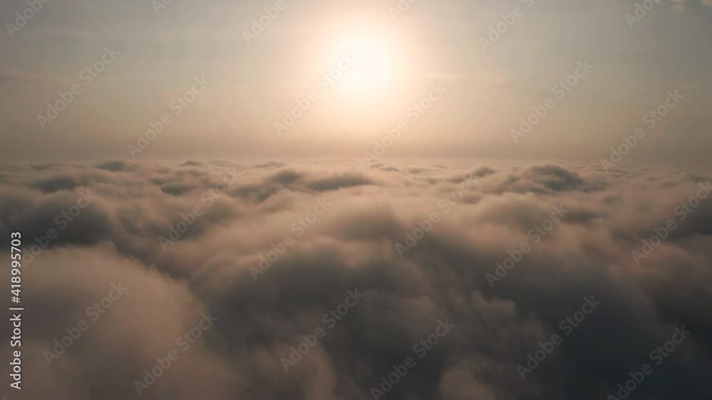 Beautiful misty dawn. Flying above the clouds, drone video. Beautiful misty dawn. Flying above the clouds, drone video.
