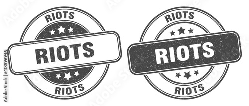 riots stamp. riots label. round grunge sign