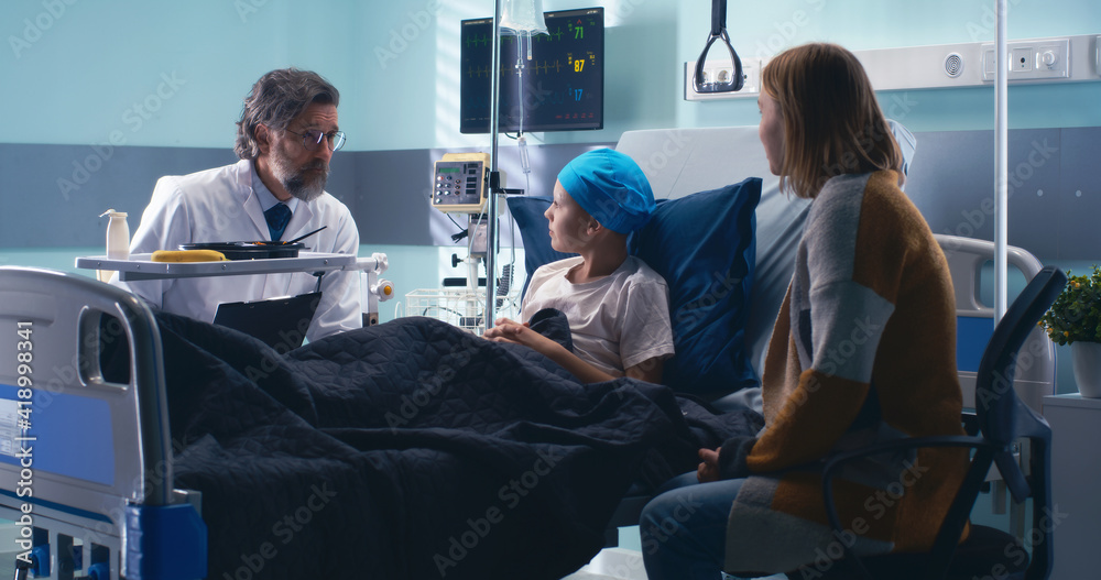Doctor telling good news to boy and woman Doctor telling good news to boy and woman
