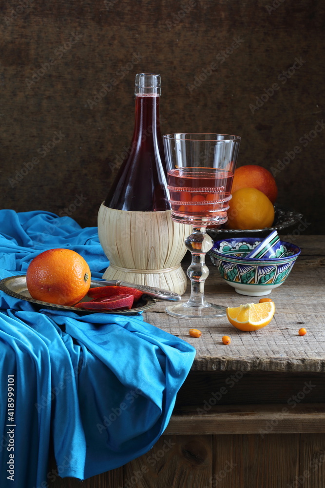 Obraz premium Still life with red wine and citrus 