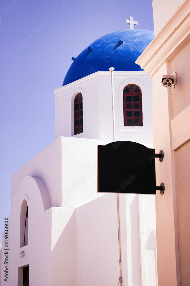 Santorini, Greece : Close up of a Typical Iconic blue domed church in the town of Thira on the greek island Santorini (Thera)