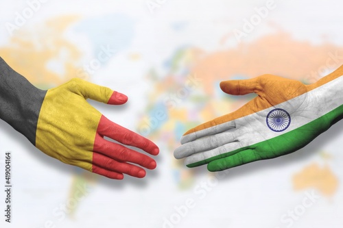 Belgium and India - Flag handshake symbolizing partnership and cooperation