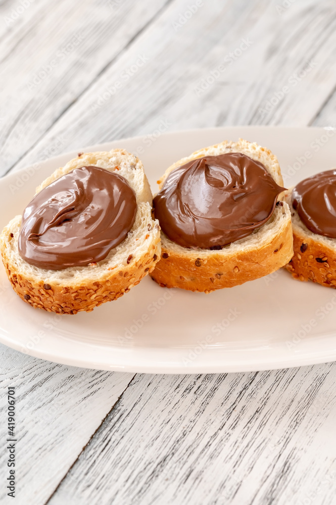 Slices of baguette with chocolate paste Slices of baguette with chocolate paste