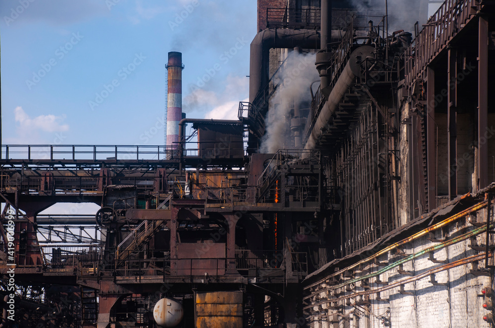 the coke pusher pushes the coke. Coke oven battery. coke and chemicals plant/ the coke pusher pushes the coke. Coke oven battery. coke and chemicals plant/