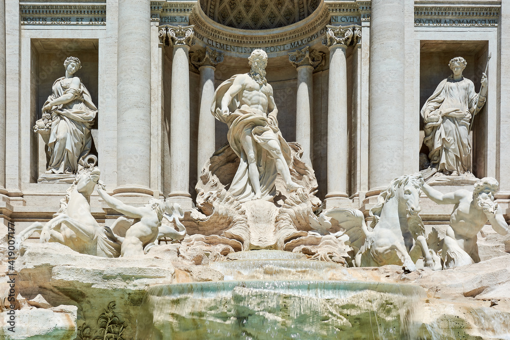A close up of the sculptures at the front of the Trevi Fountain in Rome, Italy
