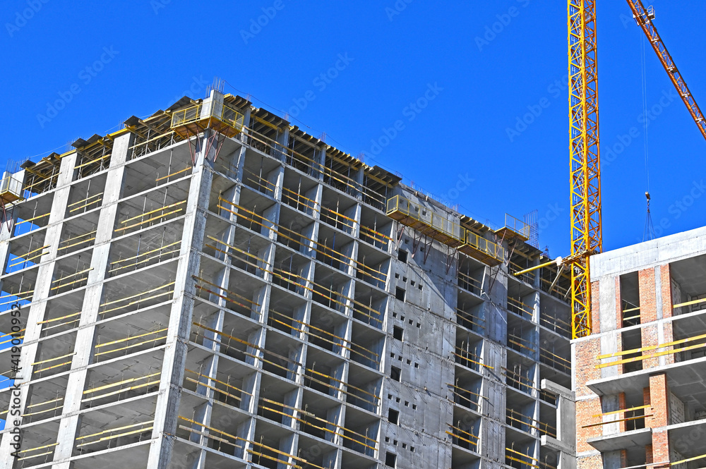 Crane and highrise construction site Crane and highrise construction site
