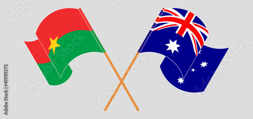 Crossed and waving flags of Burkina Faso and Australia