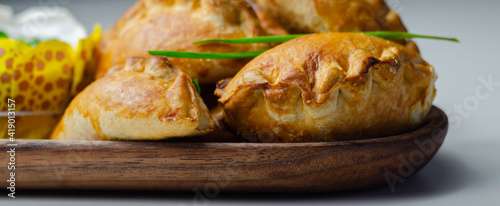 Bild auf Leinwand Mini pasties with sour cream, succulent pork, turkey, bacon and cranberry all wr