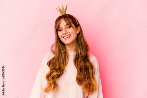 Young caucasian woman with princess crown isolated happy, smiling and cheerful.