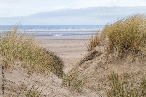 Fototapeta Naklejka Na Ścianę i Meble -  Irish Sea between the sand dunes