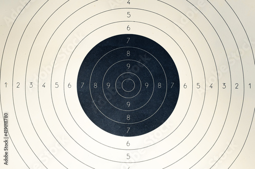 Blank paper target with shooting range numbers. A round, clean target with a marked bull's-eye for shooting practice on the range photo