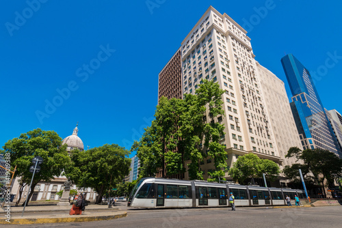 VLT Tram Crossing Presidente Vargas Avenue With Tall Buildings and Candelaria Church