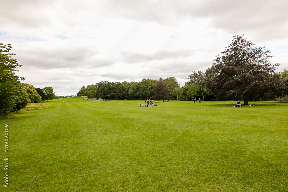 The lush grass lawn at Kilkenny Castle in Ireland The lush grass lawn at Kilkenny Castle in Ireland