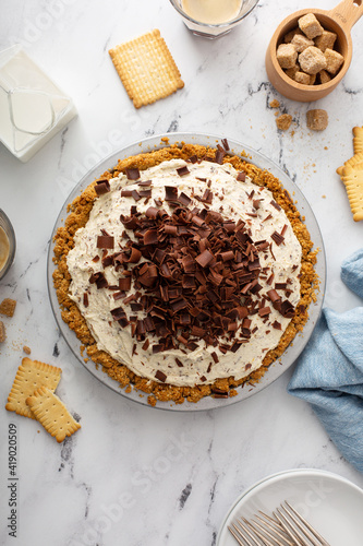 Ricotta and chocolate Cannoli pie, italian inspired dessert topped with chocolate curls served with espresso photo