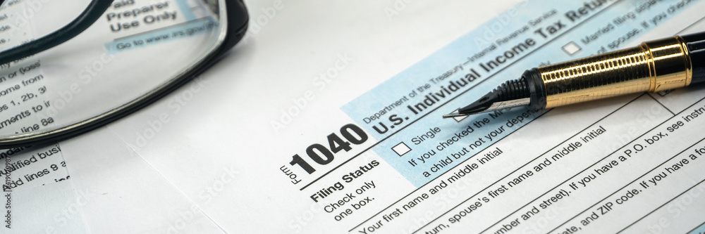 Tax form USA business income office concept. Tax Return Form 1040, wide banner Tax form USA business income office concept. Tax Return Form 1040, wide banner