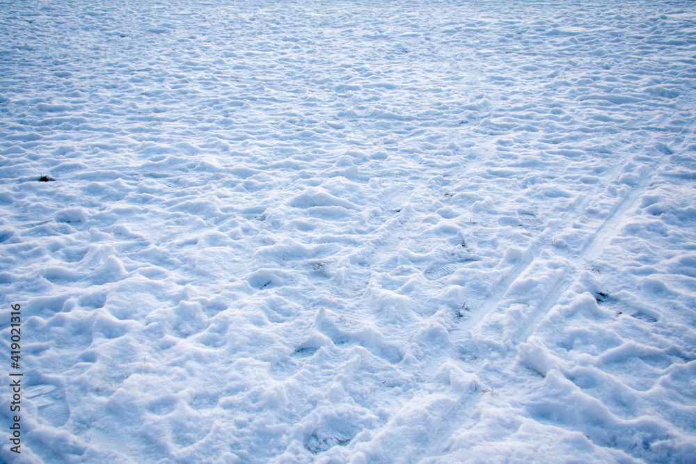 Snow landscape covered with foot prints in Berlin Germany 2021