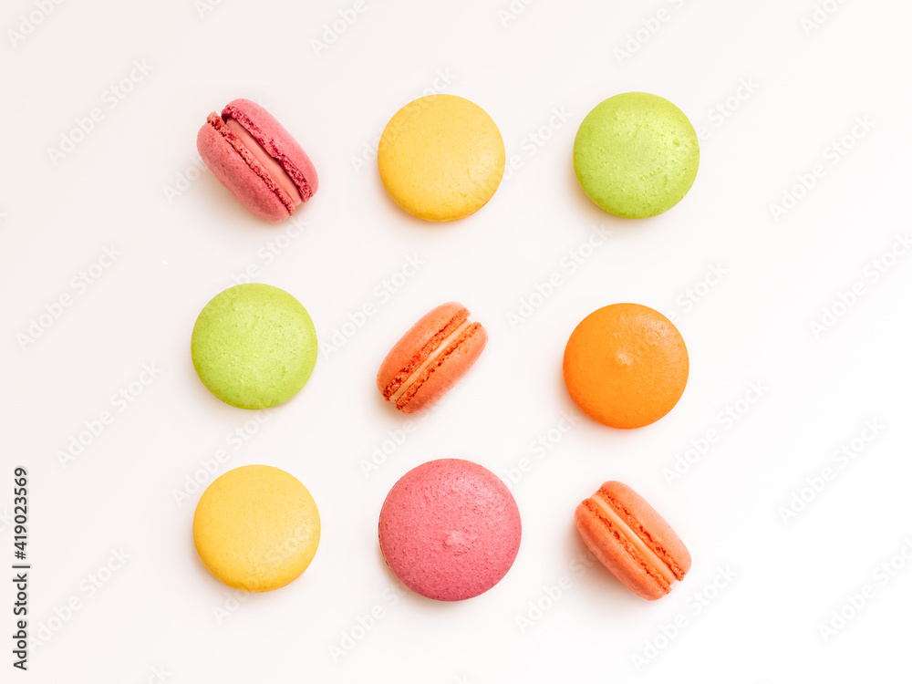French biscuits Flat lay photo in minimal style Colorful almond cookies are lying in rows on white background French biscuits Flat lay photo in minimal style Colorful almond cookies are lying in rows on white background