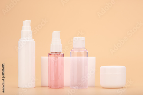 Variety of skin care products against beige background. Beauty products for daily home skin treatment. Anti aging or regular beauty products for fresh, young looking skin © Irina Ivanova