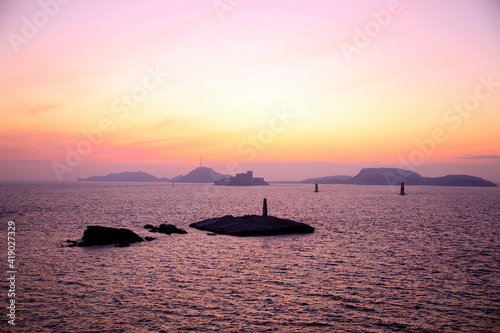 Violet colors of sunset on the silhouettes of the islands of the If archipelago, Parc National des Calanques, Marseille, France