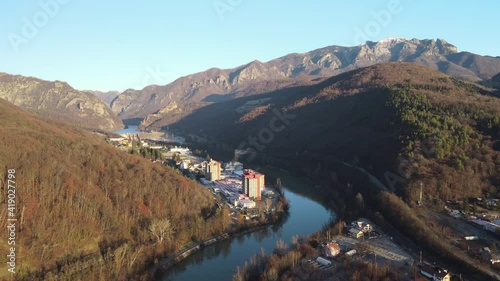 Aerial drone Calimanesti Caciulata Hotels in Valcea.  Cozia Monastery near Olt River bridge environment in mountain Olt Valley beautiful gorge river in Romania, defile carved valley near national park photo