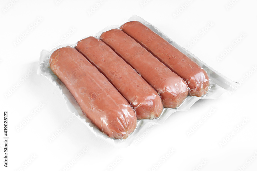 Sausages in plastic wrap package isolated on white background. Sausages in plastic wrap package isolated on white background.
