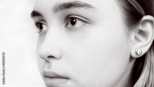 black and white portrait of a girl in profile with big beautiful eyes