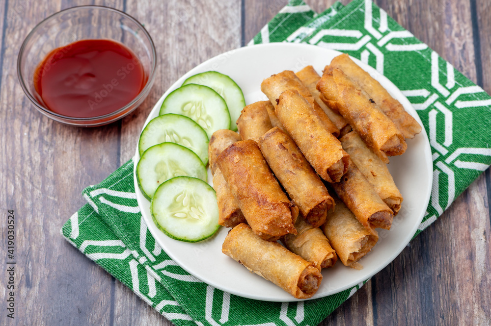 Pork Lumpiang Shanghai (topshot) is a Filipino favorite, its a dish usually served at parties and feasts. This is very similar to a spring roll. Pork Lumpiang Shanghai (topshot) is a Filipino favorite, its a dish usually served at parties and feasts. This is very similar to a spring roll.