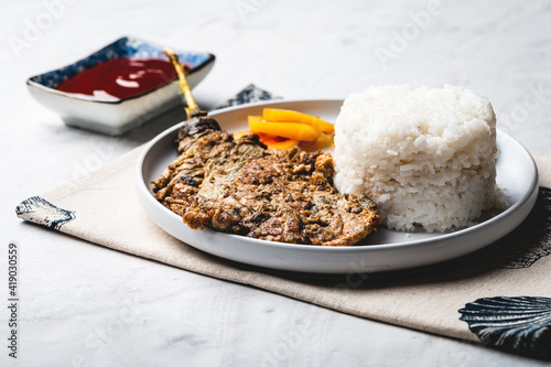 Tortang Talong (Eggplant Omelet) Full - is simple but famous Filipino dish usually eaten with white rice photo