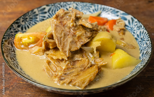 Malaysian dish salted fish curry or locally known as Gulai Ikan Masin.  photo