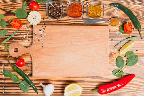 Cooking table. Background with spices and vegetables. Top view. Free space for your text.