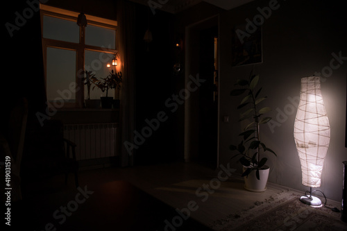 Night scene of moon seen through the window from dark room. Moonlight inside dark room. Long exposure shot