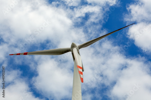 Wind turbine on cloudy sky © wajan