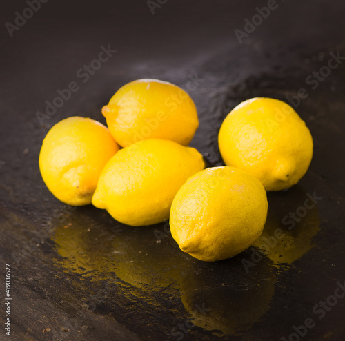Tasty lemons isolated on the black background.