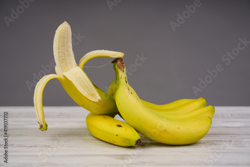 Ripe bananas on a wooden table
