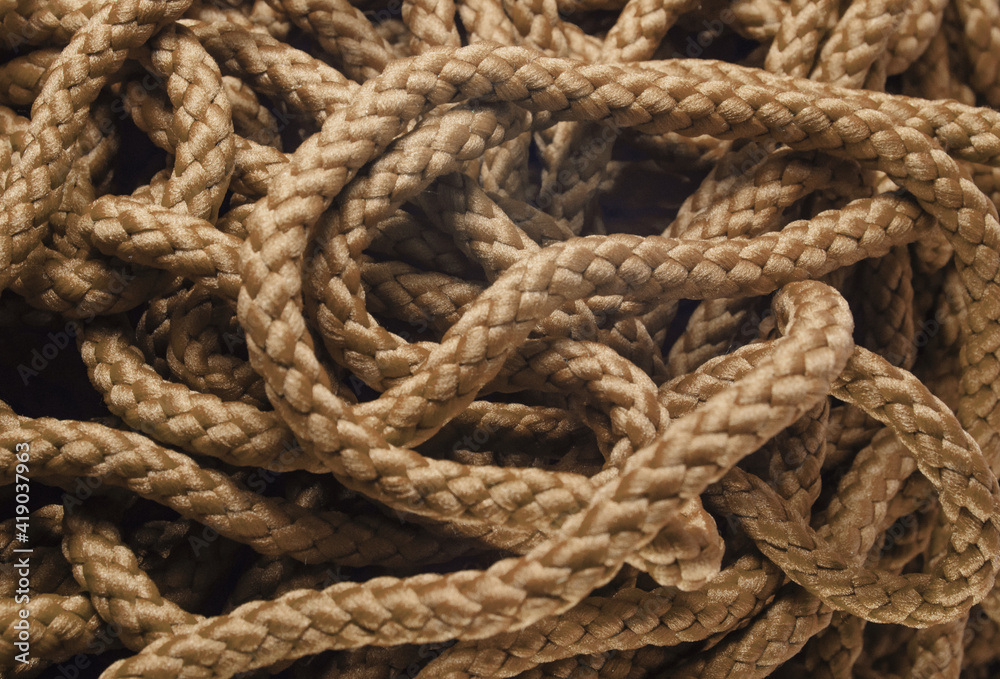 rope with knot. brown polyester rope background