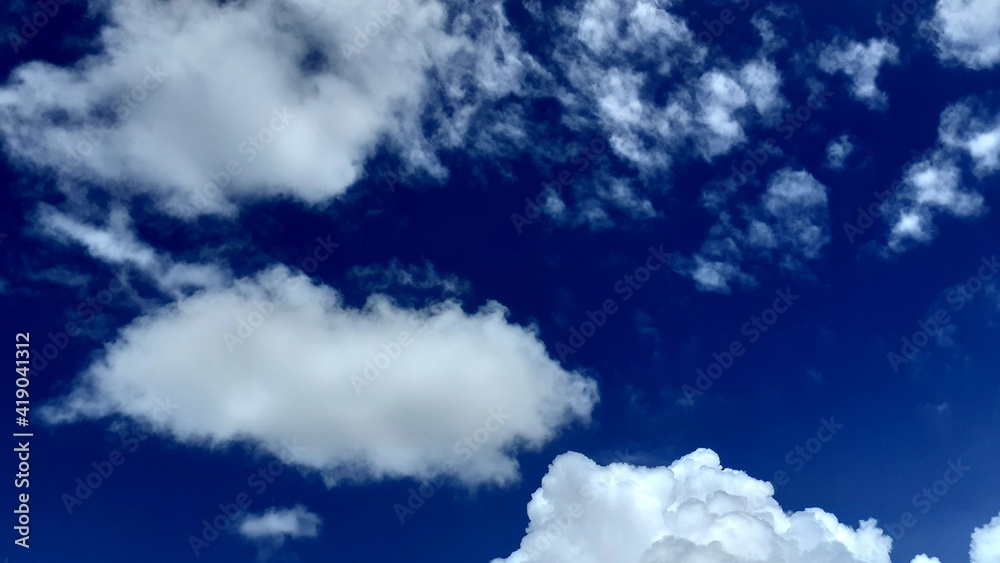 Fototapeta premium Beautiful white clouds, blue sky, the azure stratosphere, and spindrift, with texture background in nature for wallpaper pattern concept.