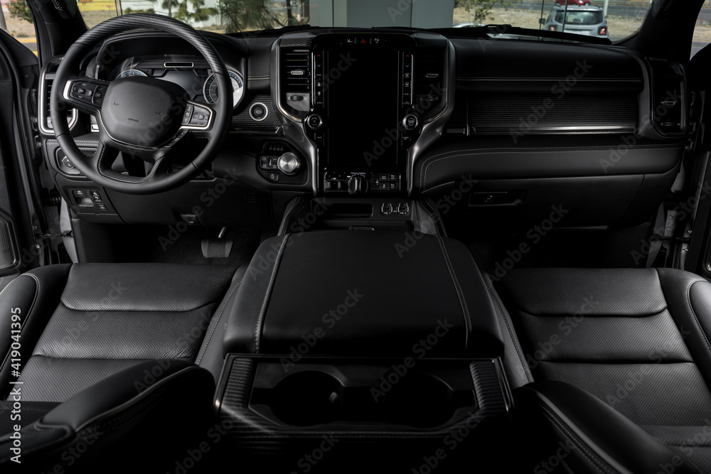 black Interior of luxurious car with modern details, leather seats and touch screen