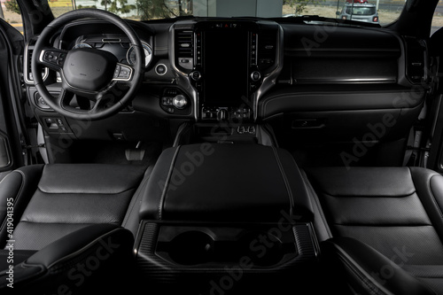 black Interior of luxurious car with modern details, leather seats and touch screen © JesusCarreon