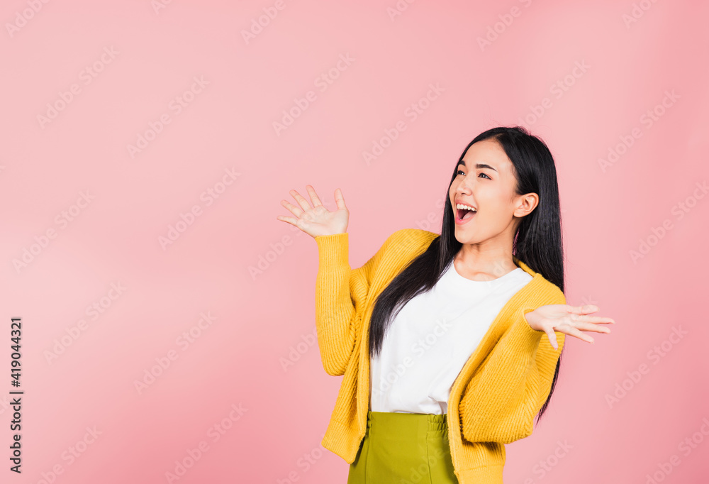 Happy Asian portrait beautiful cute young woman standing winning and surprised excited screaming open mouth raise hands, studio shot isolated pink background, Thai female wow with copy space Happy Asian portrait beautiful cute young woman standing winning and surprised excited screaming open mouth raise hands, studio shot isolated pink background, Thai female wow with copy space