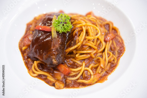 spaghetti bolognese sauce with pork ribs roast on white plate, Traditional italian spaghetti